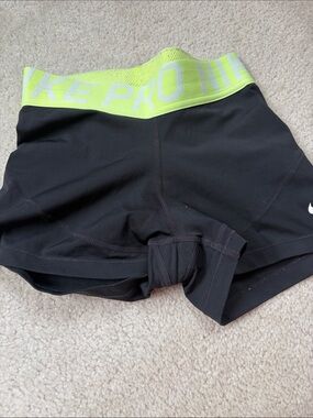 Nike Women's Black Athletic Shorts with Neon Yellow Waistband